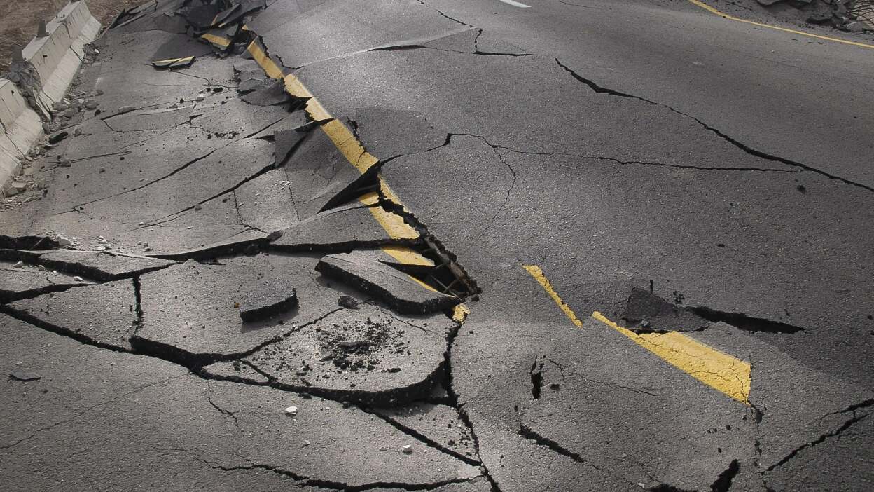 cracked asphalt after earthquake