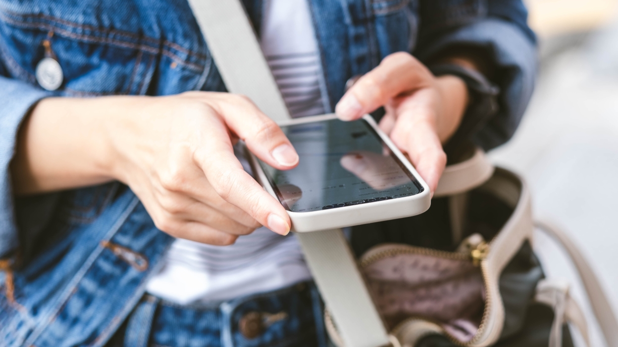 close-up of woman's hand using phone