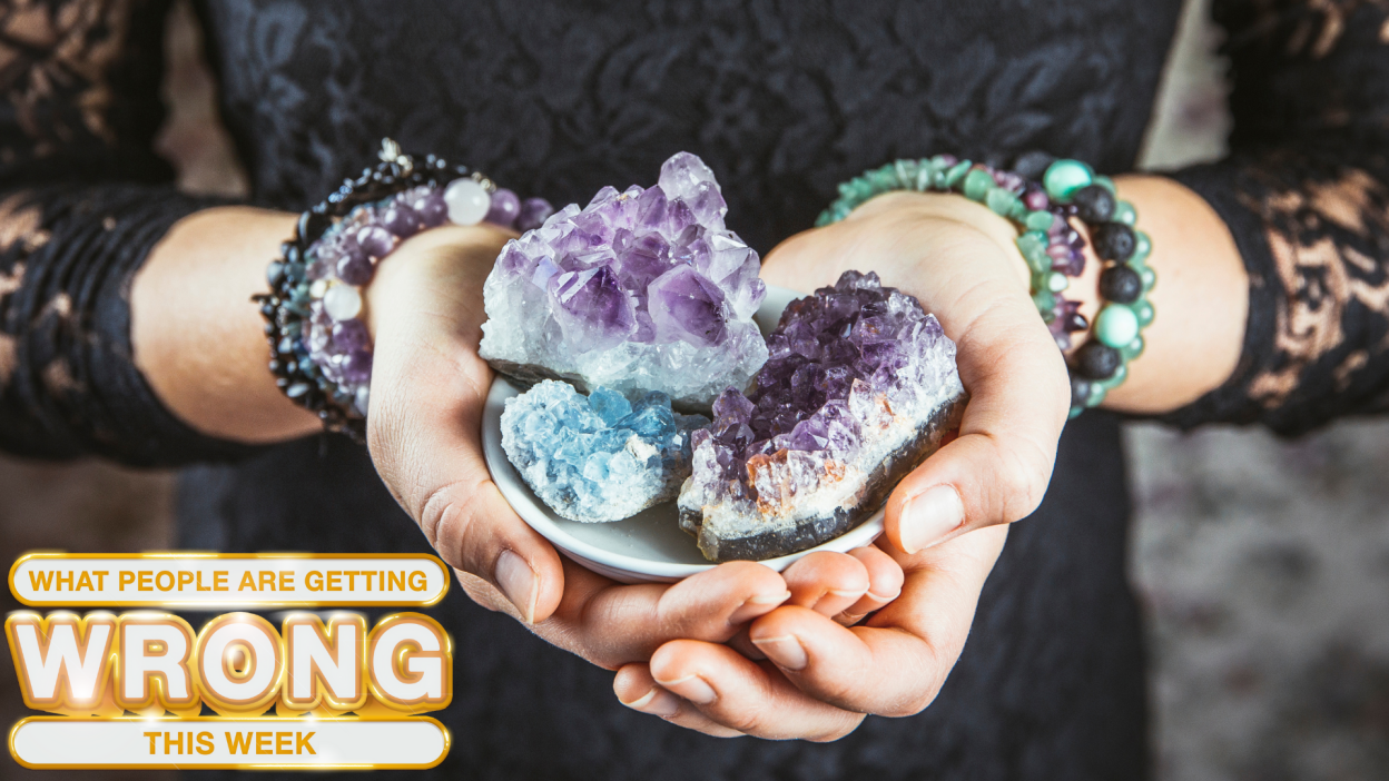 A woman holds crystals