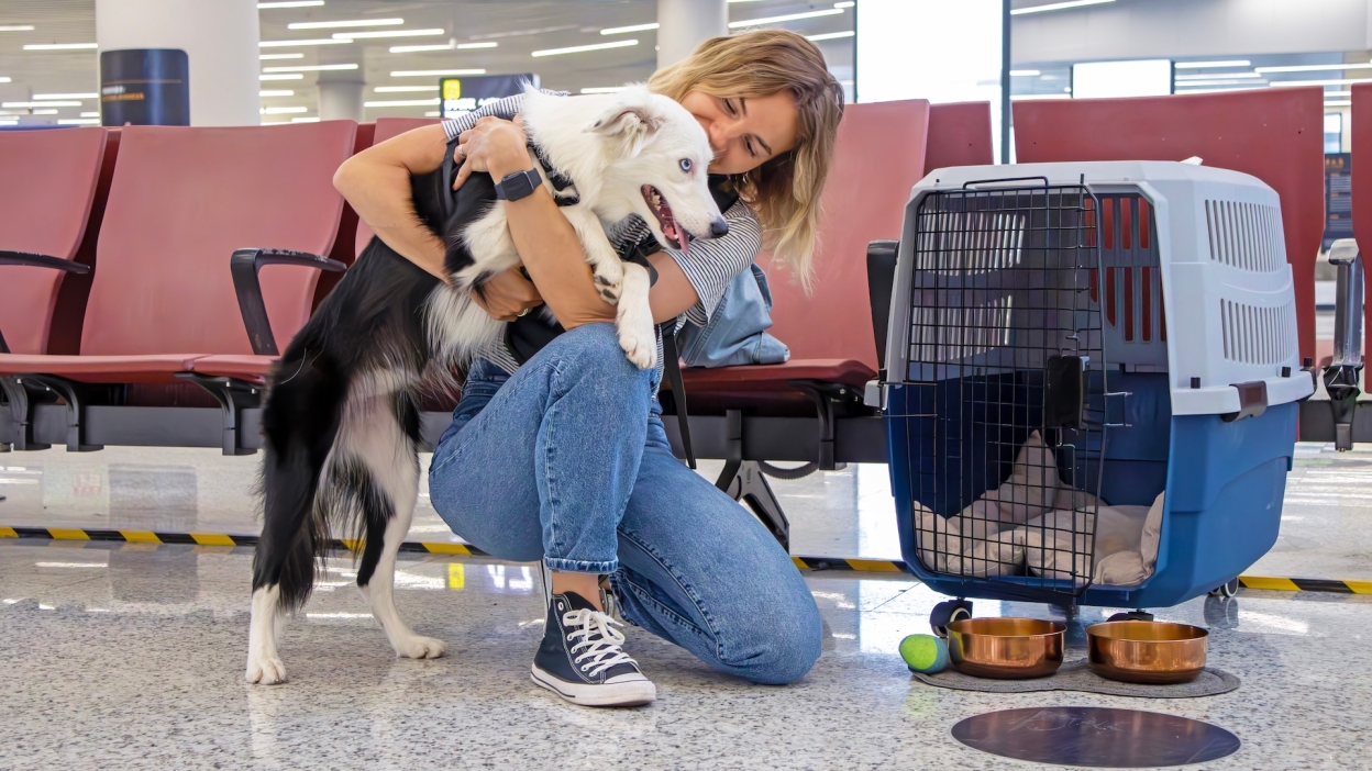 woman and dog in airport 