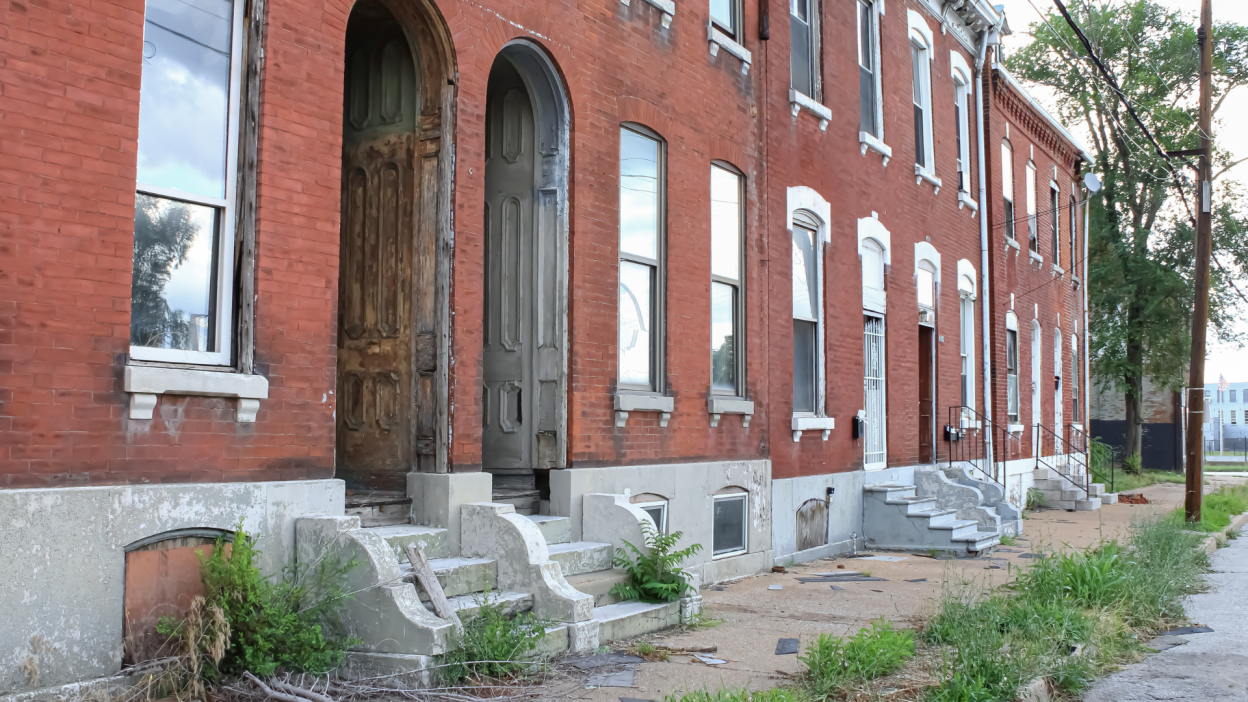 brick apartment building in disrepair