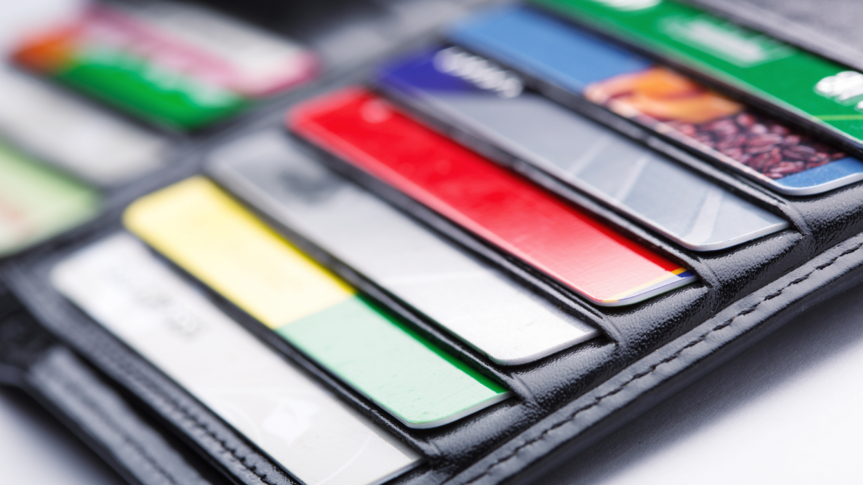 A leather wallet with credit cards poking out